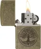 An open Zippo lighter with a flame, featuring an engraved tree of life design on the front. Náhľad obrázku produktu