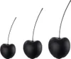 Three black ceramic cherries of increasing size are displayed against a white background. Anteprima dell’immagine prodotto