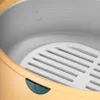 Close-up view of the interior of a wax melter, showing the heating pot and a white grate. Anteprima dell’immagine prodotto