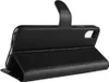 A black leather flip case for a smartphone is shown from the side, open and propped up. Produktbild-Vorschau