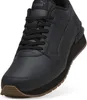 A black Puma sneaker with a brown sole is shown from a slightly elevated side angle against a white background. Voir les images du produit