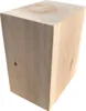 A solid block of light-colored wood, likely oak, is shown against a white background. The wood grain is visible, and the top surface shows tree rings. Produktbild-Vorschau