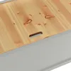 A close-up view of the lid of a storage bench, showing the wood grain and a handle cutout. Náhľad obrázku produktu