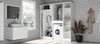 A modern laundry room with a washing machine, storage cabinets, and a vanity. Náhľad obrázku produktu