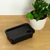 A black plastic storage container with a lid is placed on a wooden floor next to a potted plant. Anteprima dell’immagine prodotto