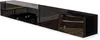 A long, black, glossy TV lowboard is shown from a diagonal angle against a white background. The board has reflective surfaces that show glimpses of a room interior, including wooden flooring, a chair, and some storage compartments within the board itself. Produktbild-Vorschau