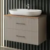 A modern bathroom vanity with a vessel sink and faucet, set against a textured dark gray wall. Produktbild-Vorschau