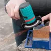 A person is using a mini angle grinder to cut a piece of metal held in a vise. Náhled obrázku produktu