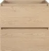 A close-up, front-facing view of a light oak bathroom vanity cabinet with two drawers. Podgląd zdjęcia produktu