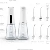 A product shot of a water flosser with various attachments, with labels pointing out different parts and features. Produktbild-Vorschau