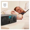 A man waking up in bed next to a radio. Produktbild-Vorschau