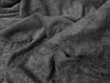 A close-up, crumpled view of a dark gray terry cloth fabric. Náhled obrázku produktu