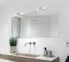 A bathroom vanity with a mirror and lights above a sink. Produktbild-Vorschau