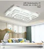 A modern living room with a sofa, decorative wall panels, and a ceiling light. Produktbild-Vorschau