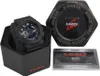 A black G-Shock watch is displayed in its black packaging, alongside its warranty card and the hexagonal G-Shock tin. Produktbild-Vorschau