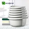 A stack of white plastic bowls with gray rims, with color swatches to the left. Produktbild-Vorschau