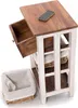 A wooden side table with a drawer pulled out and a basket next to it. Náhled obrázku produktu