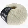 A ball of cream-colored yarn with a black label wrapped around it. Produktbild-Vorschau