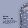 A close-up of a dog sleeping bag with a bone pattern, showing the velcro closure. Podgląd zdjęcia produktu