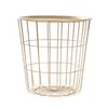 A gold wire basket table against a white background. Produktbild-Vorschau