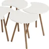 Four nesting tables with crescent-shaped white tops and wooden legs, arranged on a white background. Náhled obrázku produktu