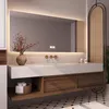A modern bathroom vanity with a ceramic sink, LED mirror, and wooden drawers. Anteprima dell’immagine prodotto