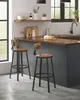 Two bar stools in a modern kitchen setting with a wooden countertop and dark cabinets. Náhled obrázku produktu