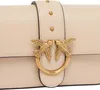 A close-up of a beige handbag's clasp. Podgląd zdjęcia produktu