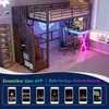 A loft bed with a desk and storage underneath, set up in a room with neon lighting. Podgląd zdjęcia produktu