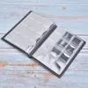 An open coin album with empty plastic sleeves, lying on a wooden surface. Podgląd zdjęcia produktu