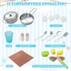 A flat lay image showcasing various toy kitchen accessories against a light blue striped background. Podgląd zdjęcia produktu