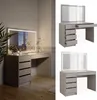 A vanity table with a lighted mirror and drawers, shown in a room setting and as a standalone product shot. Produktbild-Vorschau