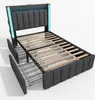 A 3D rendering of a grey upholstered bed frame with wooden slats and two pull-out drawers. The headboard has integrated blue LED lighting. Produktbild-Vorschau