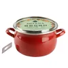 A red enamel pot with a glass lid and a label on the lid. Náhľad obrázku produktu