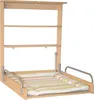 A wall-mounted folding changing table with shelves and a changing mat. Produktbild-Vorschau