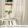 A sheer curtain is draped over a window, with a small table holding a vase of tulips in the foreground. Produktbild-Vorschau