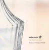 A close-up of a glass bowl with text and a logo on the right side. Podgląd zdjęcia produktu