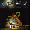 A camping scene at night with a radio and tent. Produktbild-Vorschau
