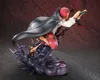 A dynamic action pose of a character figure with a flowing cape and sword. Anteprima dell’immagine prodotto