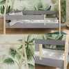 Collage of images showing a children's bed with a tropical leaf-themed wallpaper. Produktbild-Vorschau