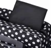 Close-up view of a black polka dot bag with a black insert. Produktbild-Vorschau