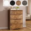 A dresser with several drawers is shown in a room with a pink wall and wooden floor. There are decorative items on top of the dresser. Above the dresser, there are circles showing different color options for the product. Podgląd zdjęcia produktu