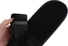 A hand is holding a black elastic band with blue stitching, showing the texture and material. Náhľad obrázku produktu