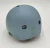 A blue and green helmet on a white background. Voir les images du produit