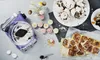 A kitchen scene with a purple stand mixer, cake pops, meringues, and cinnamon rolls. Anteprima dell’immagine prodotto