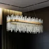 A rectangular chandelier with many glass rods hanging from a gold frame, suspended from the ceiling. Náhľad obrázku produktu