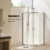 A modern bathroom with a shower cabin, sink, and window. Anteprima dell’immagine prodotto