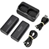 A set of two black VOLTCRAFT VC 5000-2 power banks, a charging dock, and two USB cables are arranged on a white background. Produktbild-Vorschau
