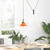 A dining table set with plates, glasses, and a vase of eucalyptus, under a pendant lamp. Produktbild-Vorschau