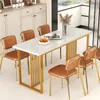 A dining table and chairs set in a modern dining room. Produktbild-Vorschau